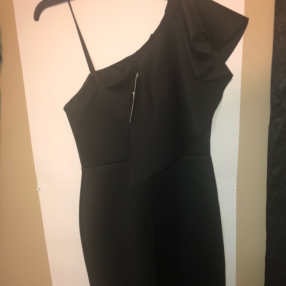 Black off the shoulder dress.